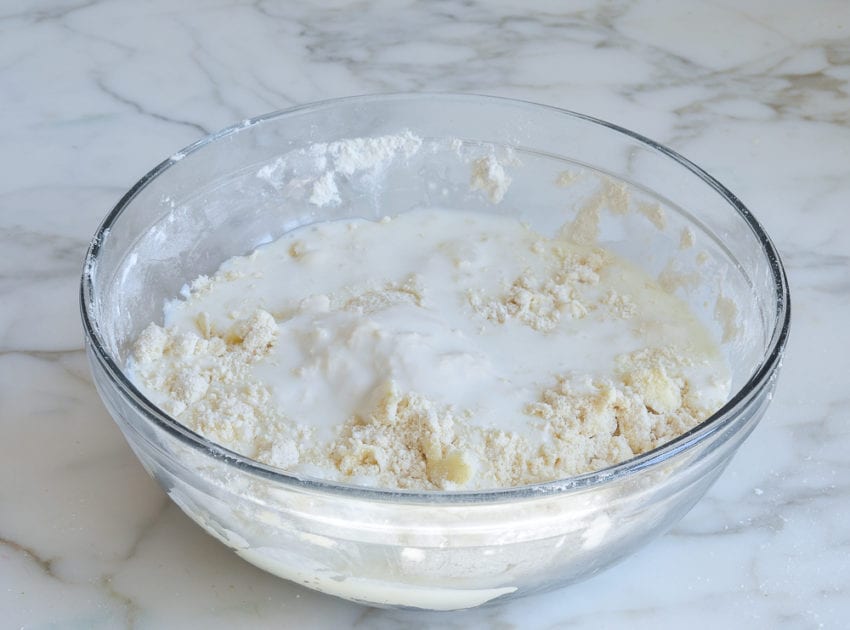 Buttermilk and dry ingredients in a bowl.