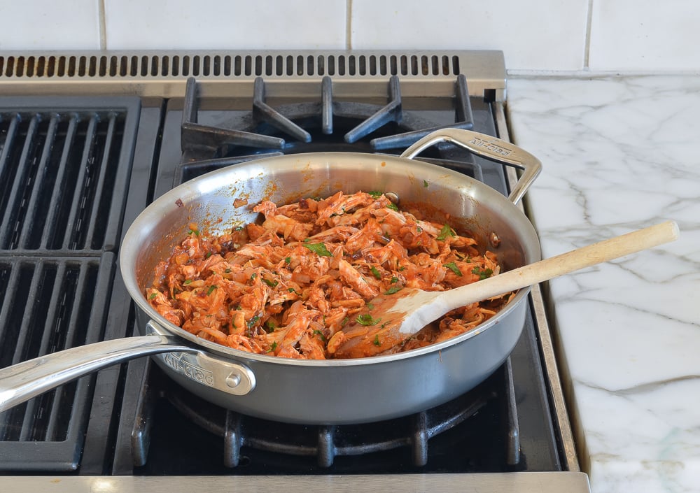Chicken nacho mixture in a skillet.