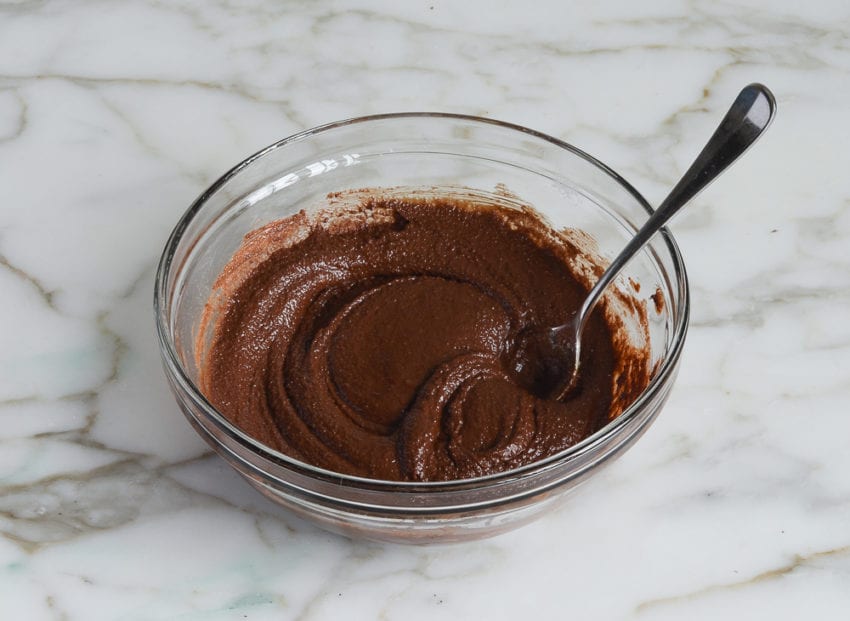 Bowl of a grainy chocolate mixture.