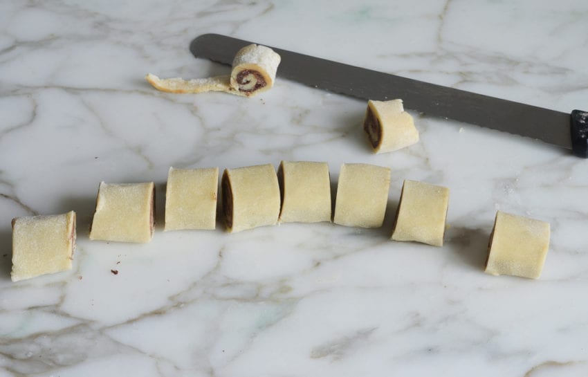 Sliced log of chocolate and dough.