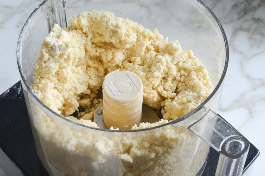 Crumbly dough in a food processor.