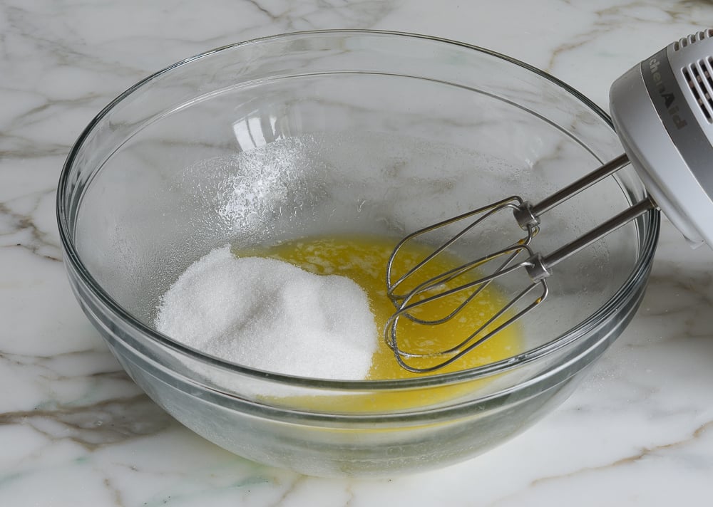 Melted butter and sugar in a bowl.