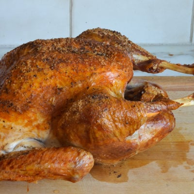 Roasted turkey on a cutting board.