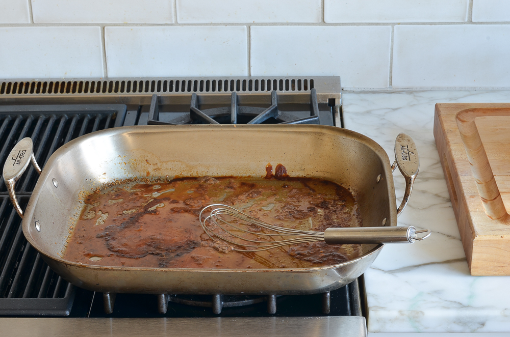 Roasting pan on a stove top.
