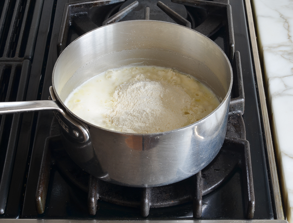 Flour in a pan with a milk mixture.