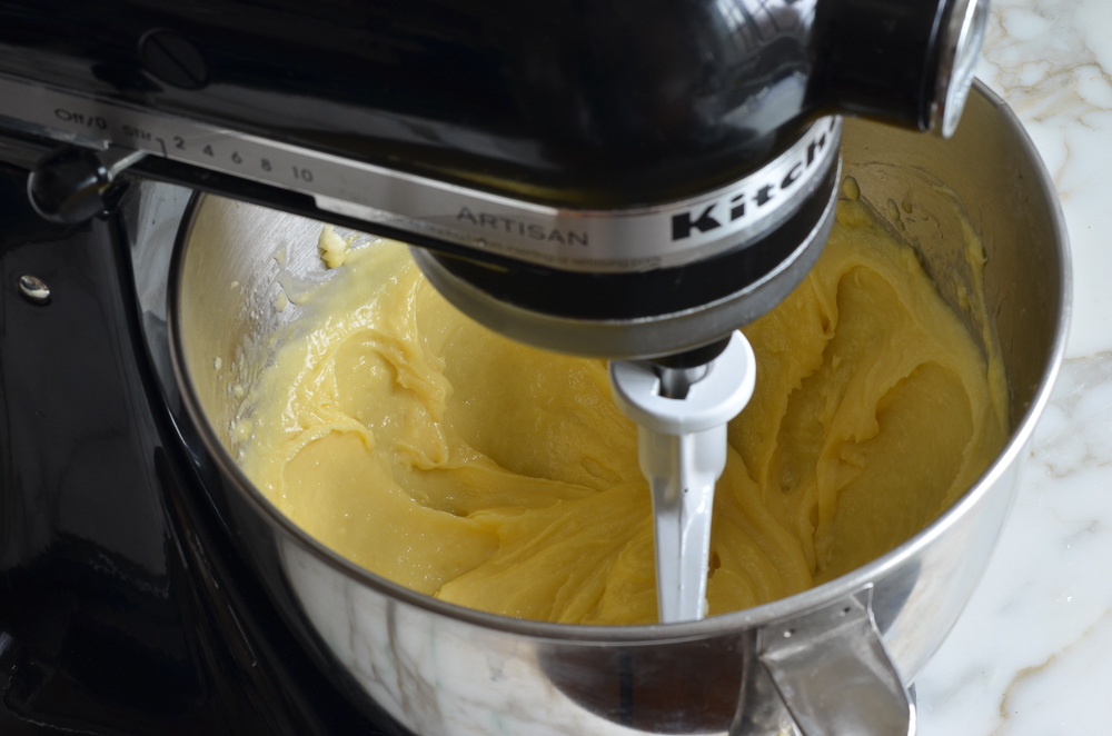 Smooth dough in the bowl of a stand mixer.