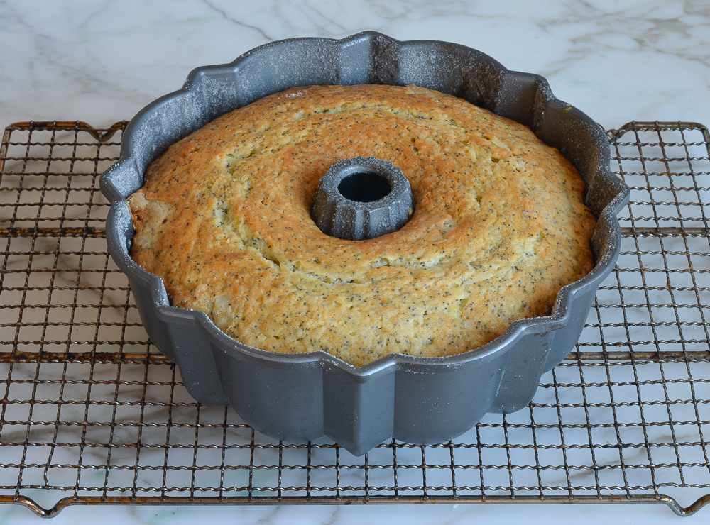 Lemon poppy seed cake in a Bundt pan.