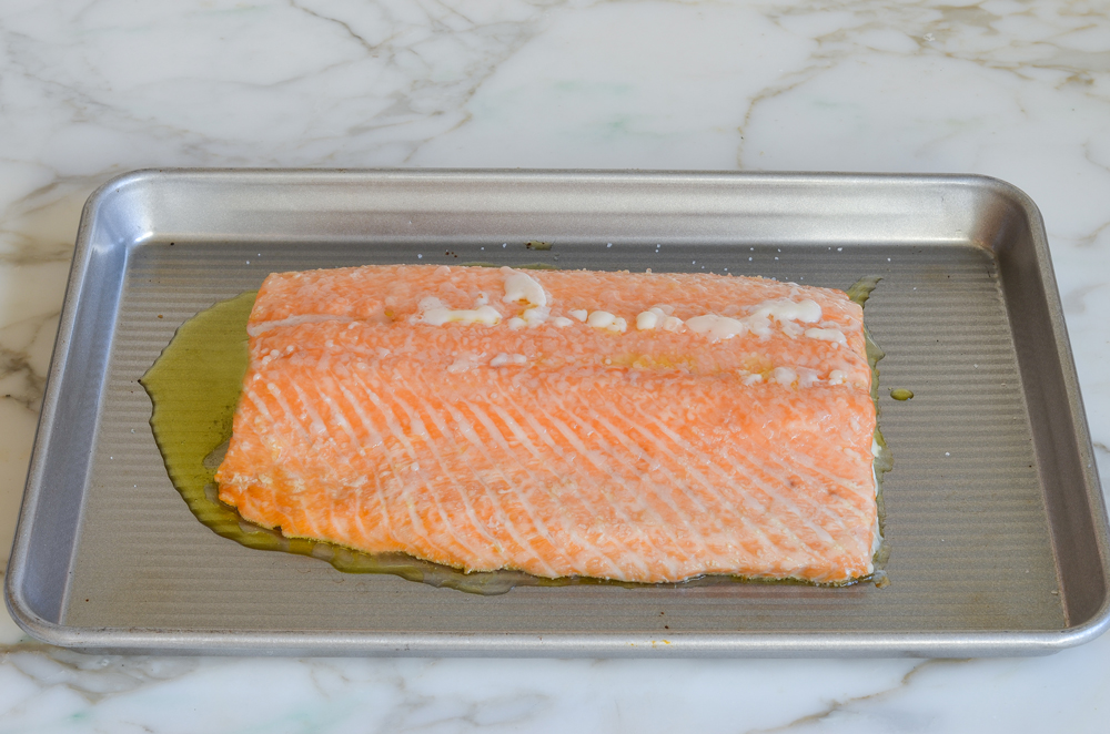 Cooked salmon on a baking sheet.
