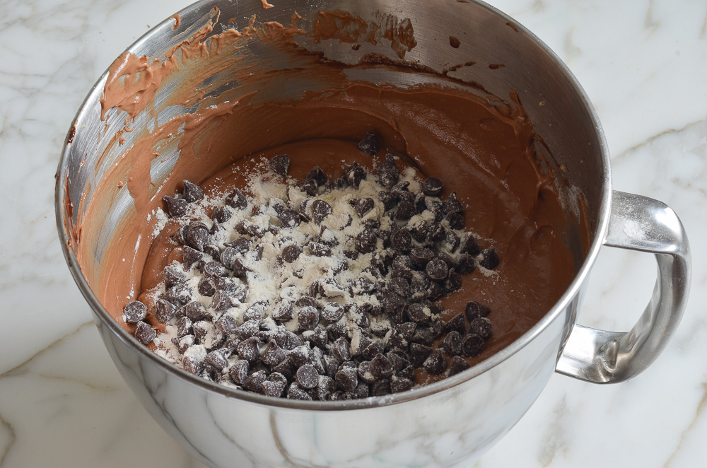 Chocolate chips in a bowl with chocolate batter.