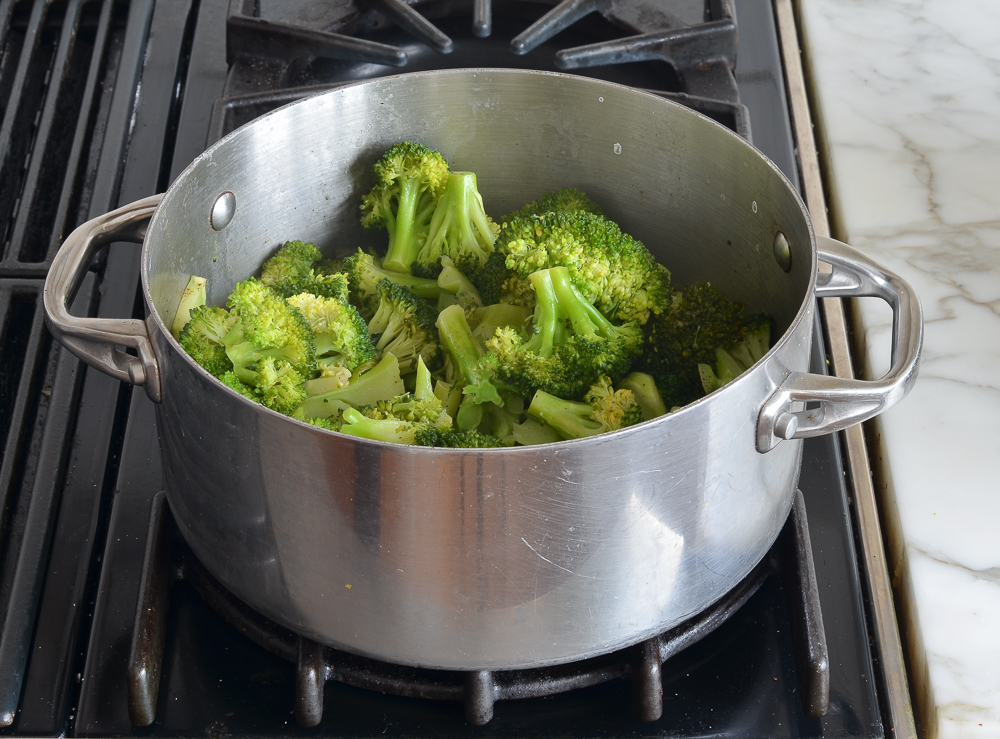Cooked broccoli in a pan.