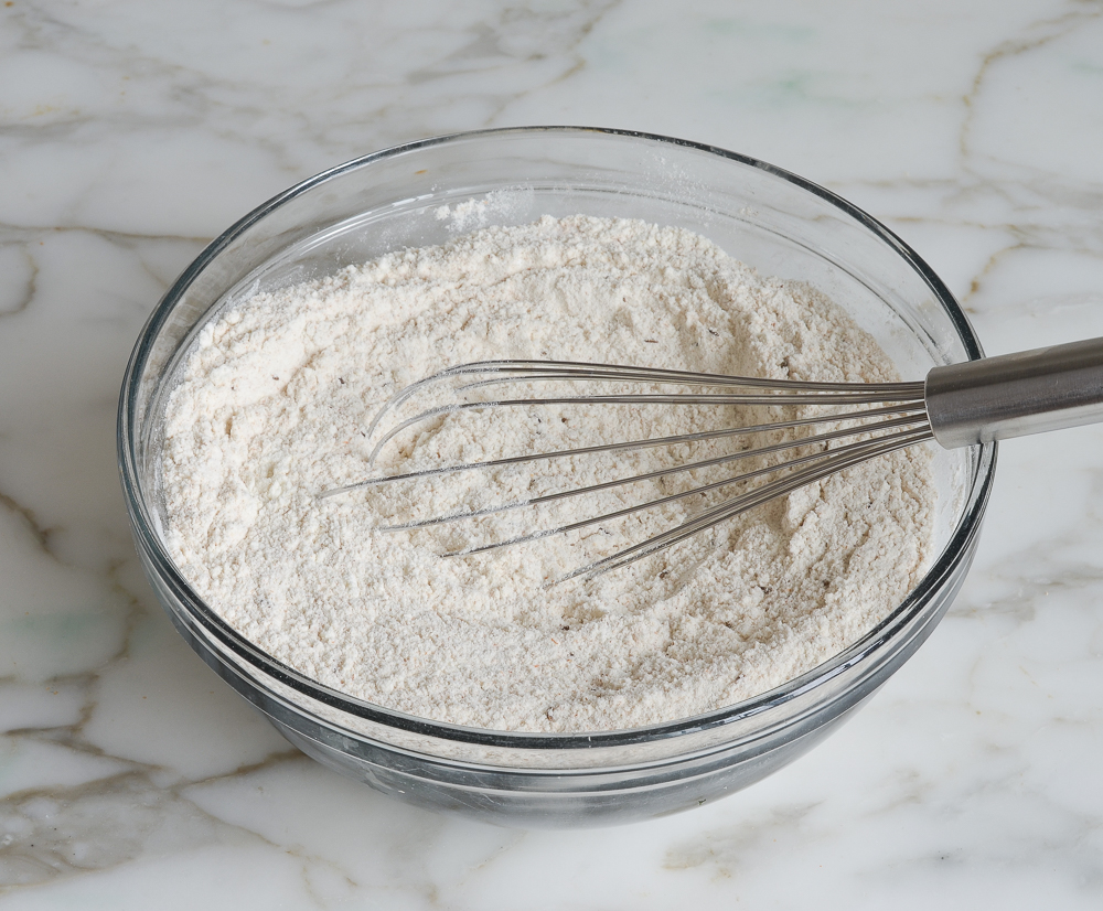 dry ingredients whisked together in a mixing bowl to make irish soda bread muffins