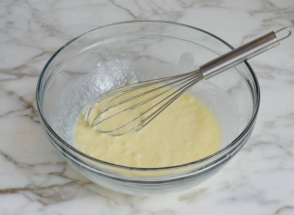 liquid ingredients whisked together in a bowl for irish soda bread muffins