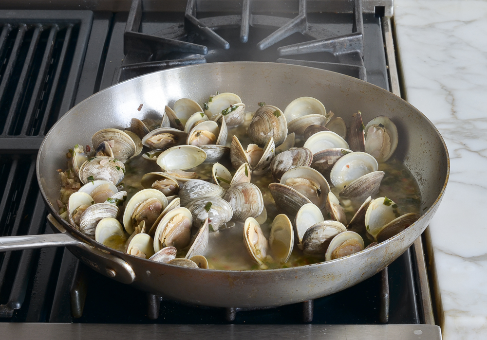 Skillet of opened clams.