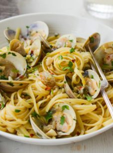 Fork in a bowl of linguine with clams.