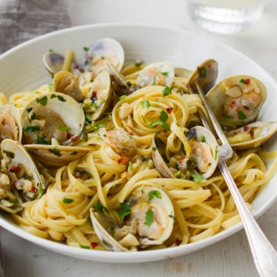 Fork in a bowl of linguine with clams.
