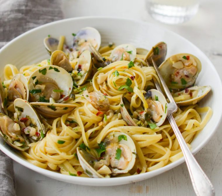 Fork in a bowl of linguine with clams.
