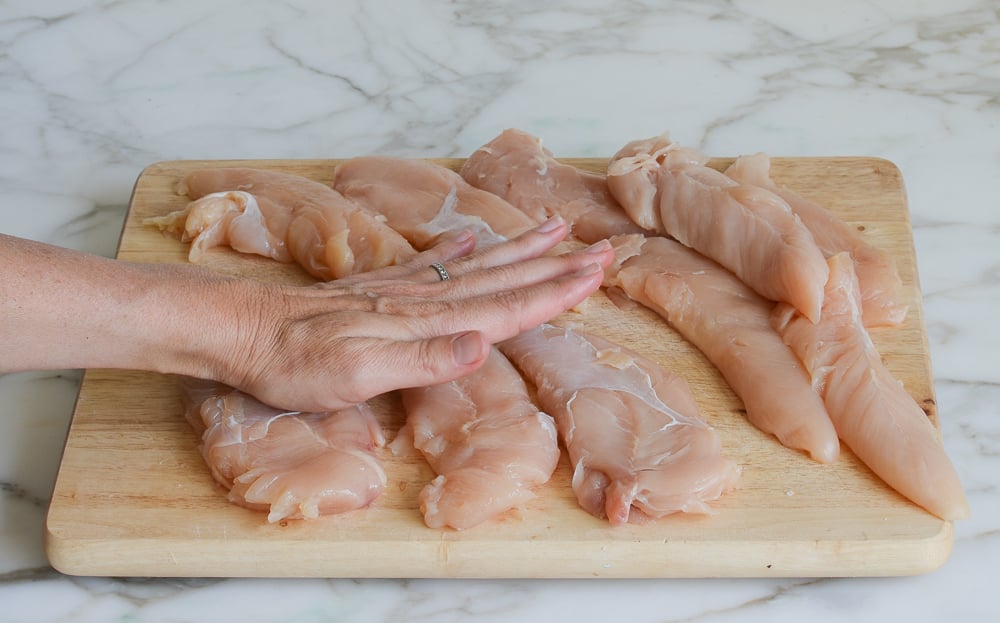 flattening chicken tenderloins with palms