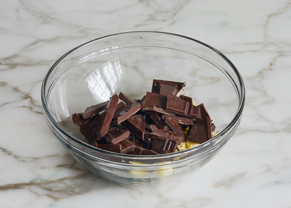 butter and chocolate pieces in mixing bowl