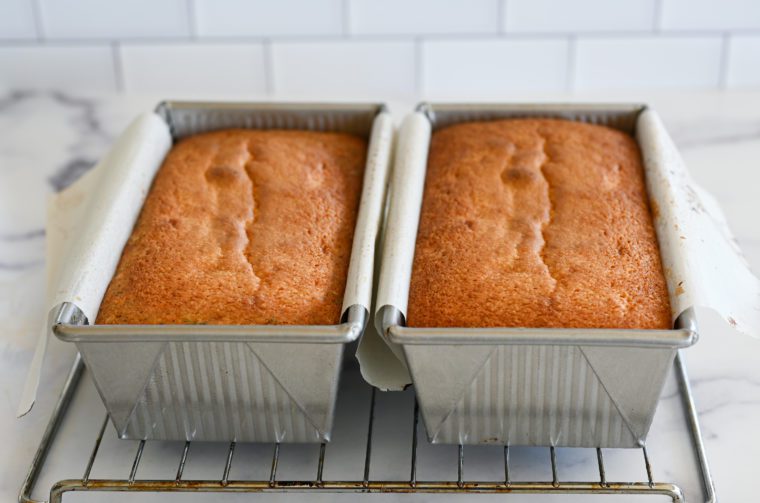 Two loaf pans of lemon pound cake.