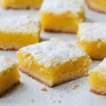 Lemon Bars dusted with powdered sugar.