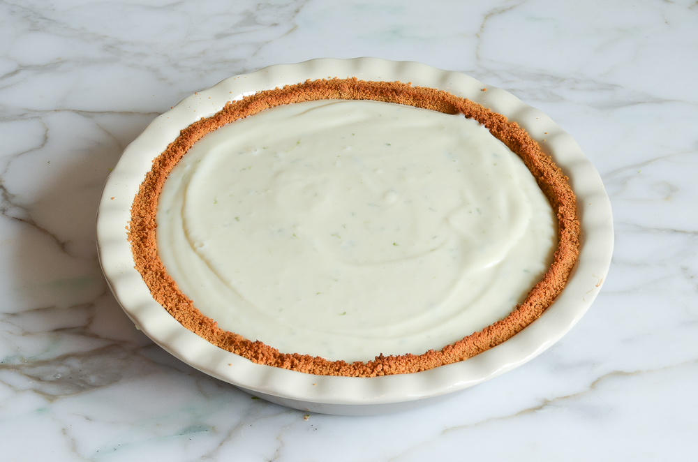 key lime pie filling poured into crust