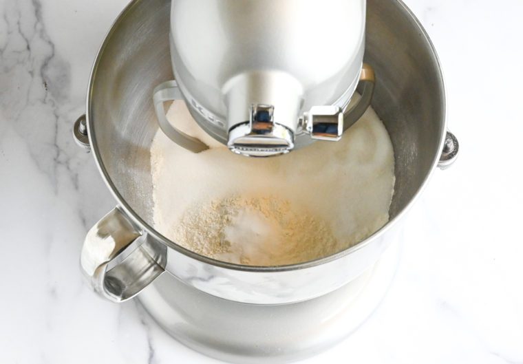 flour, sugar, baking soda, and salt in electric mixer