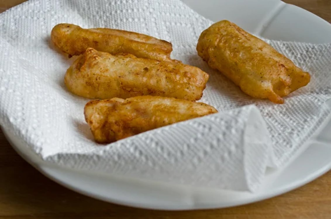 draining fried fish on paper towels