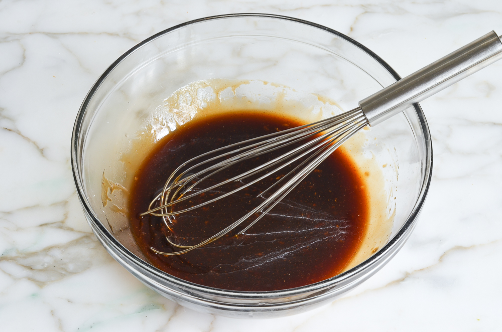 whisking the marinade and sauce