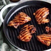 Char siu chicken on a grill pan.