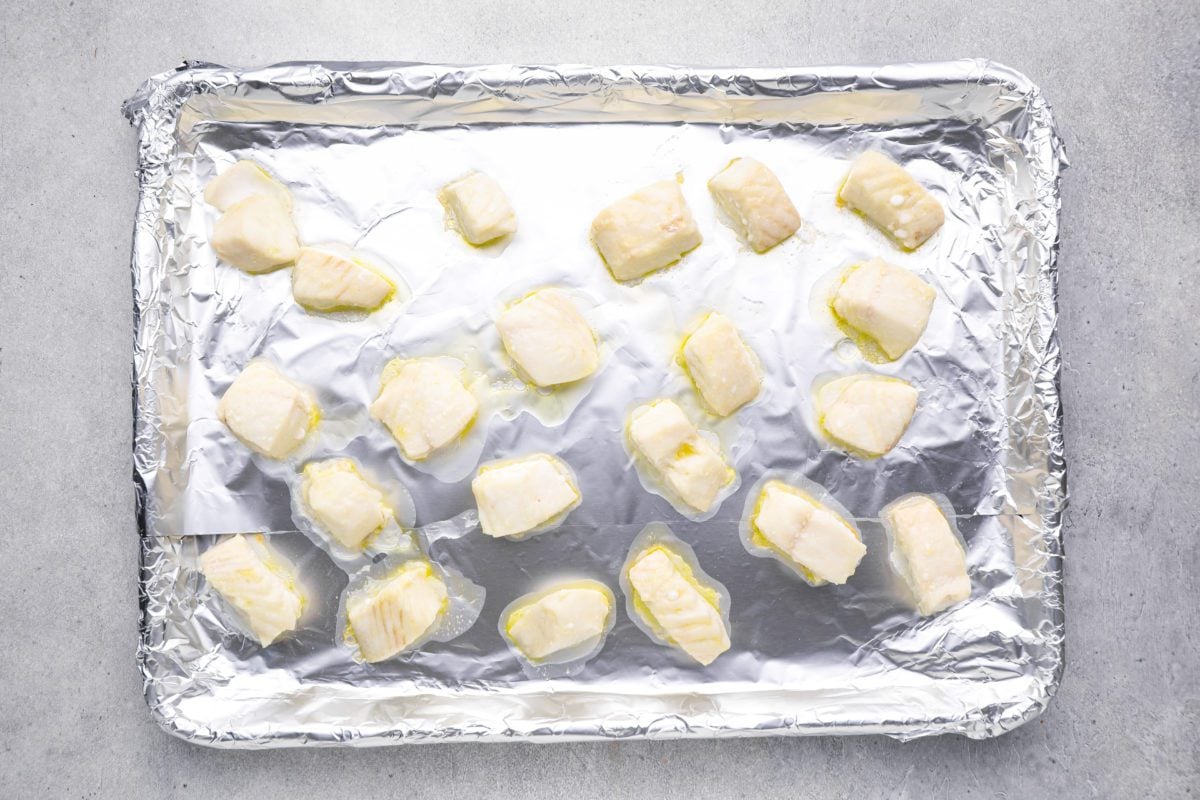 chunks of fish on baking sheet