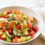 Spoon in a bowl of panzanella salad.