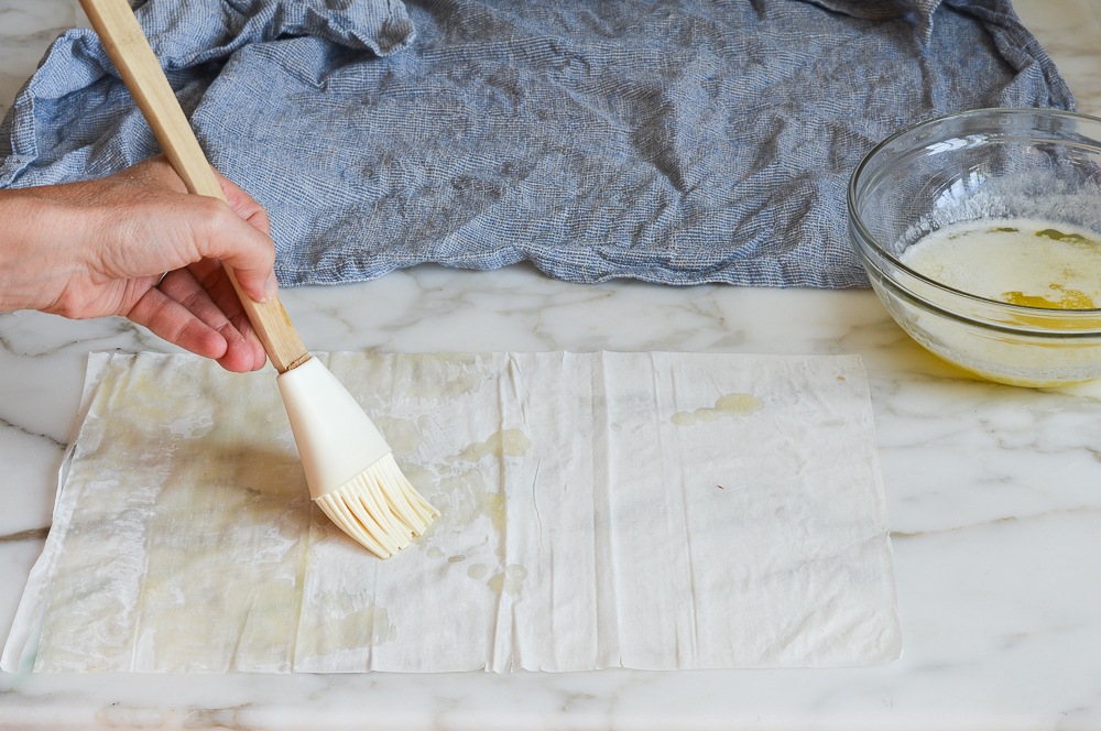 buttering first sheet of phyllo