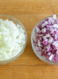 Bowls of diced red and white onions.