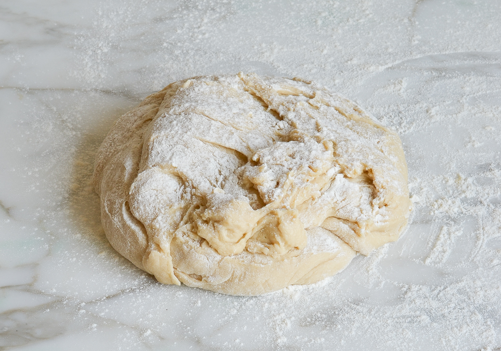challah dough on floured countertop