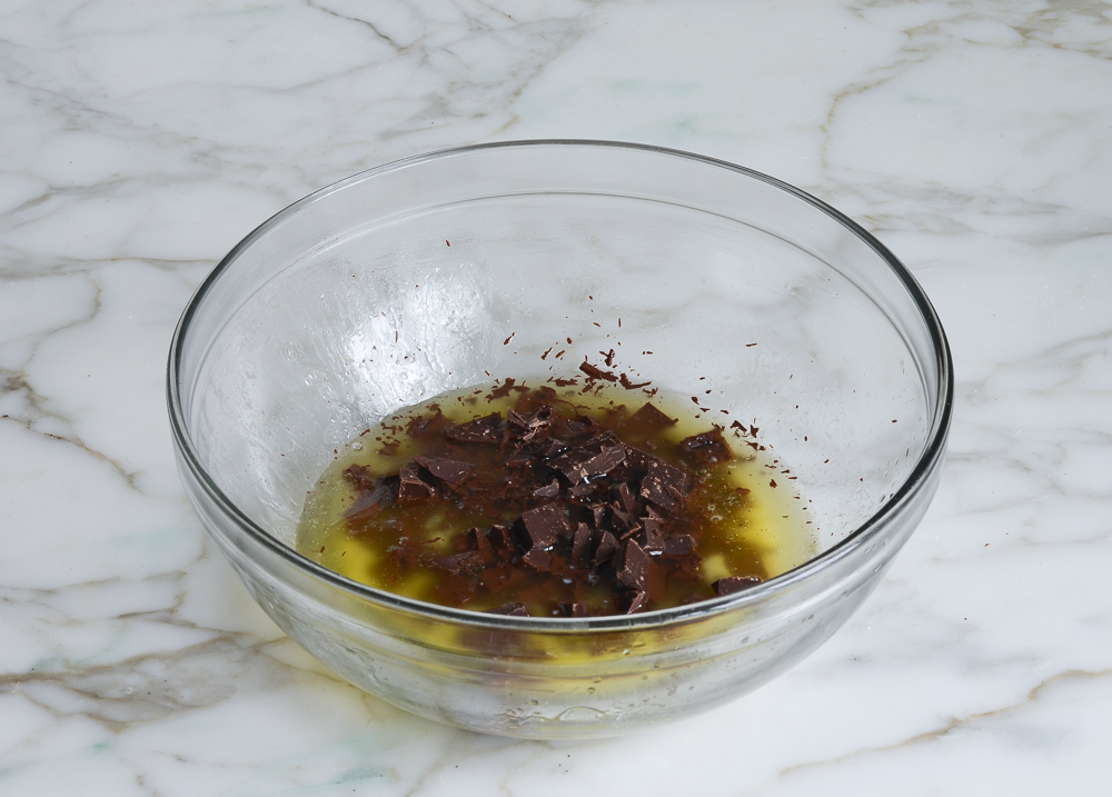 melted butter and chopped chocolate in bowl