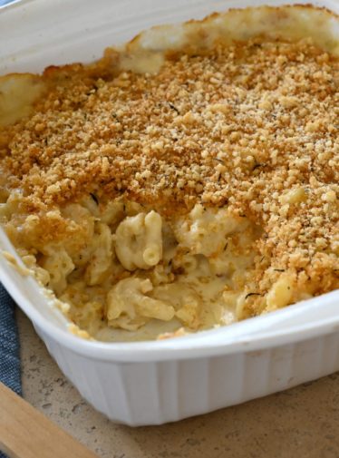 Baking dish of partially-served macaroni and cheese.