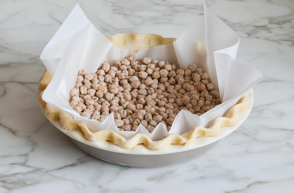 pie crust filled with dried beans