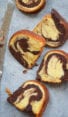 Slices of marble cake with a butter knife.