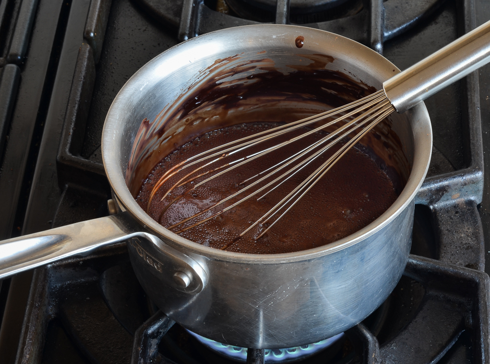 sugar, cocoa powder, and water in pan