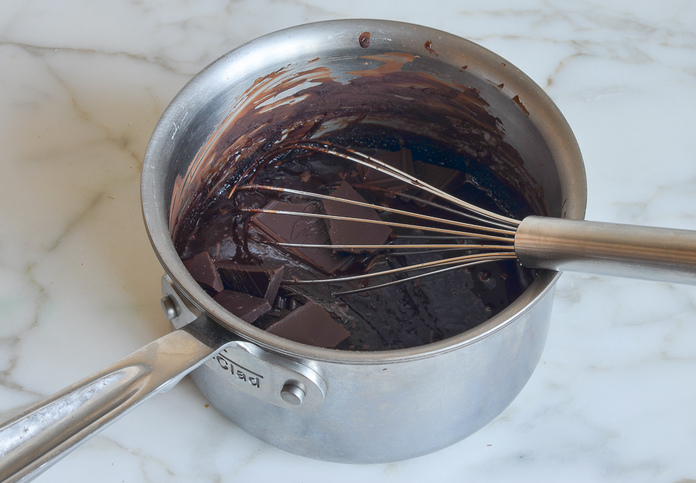 adding the chocolate pieces to the chocolate mixture