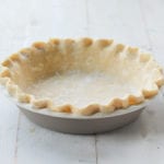 Fluted pie crust in a pie pan.