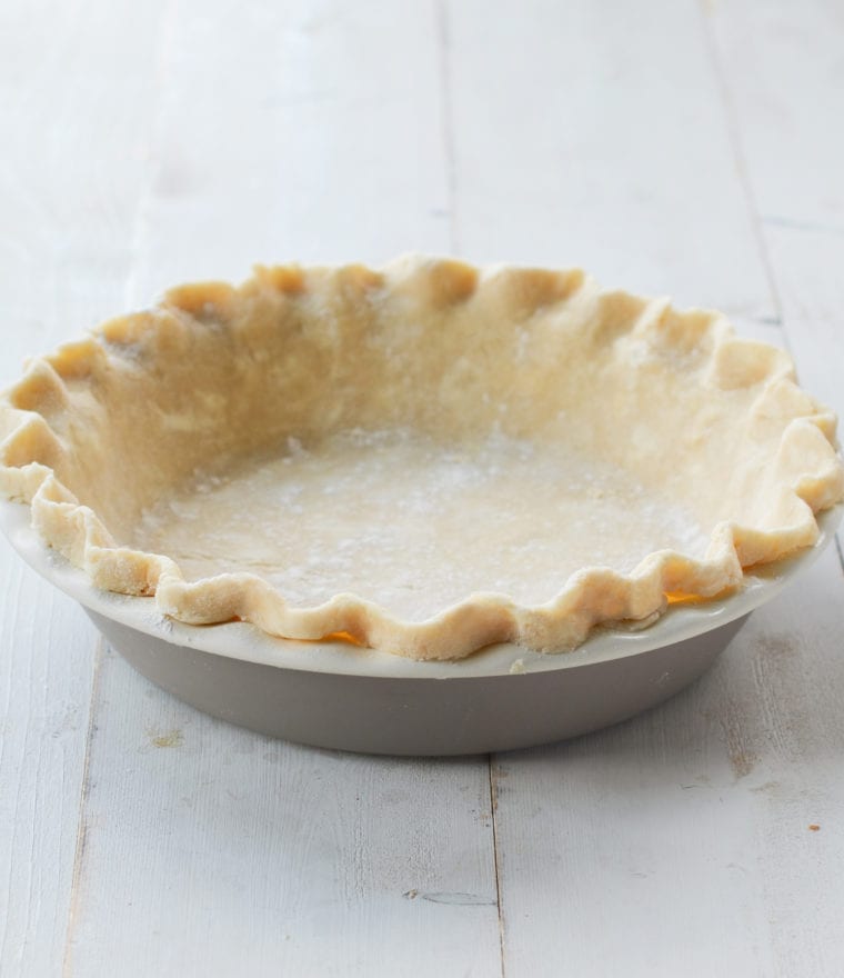 Fluted pie crust in a pie pan.