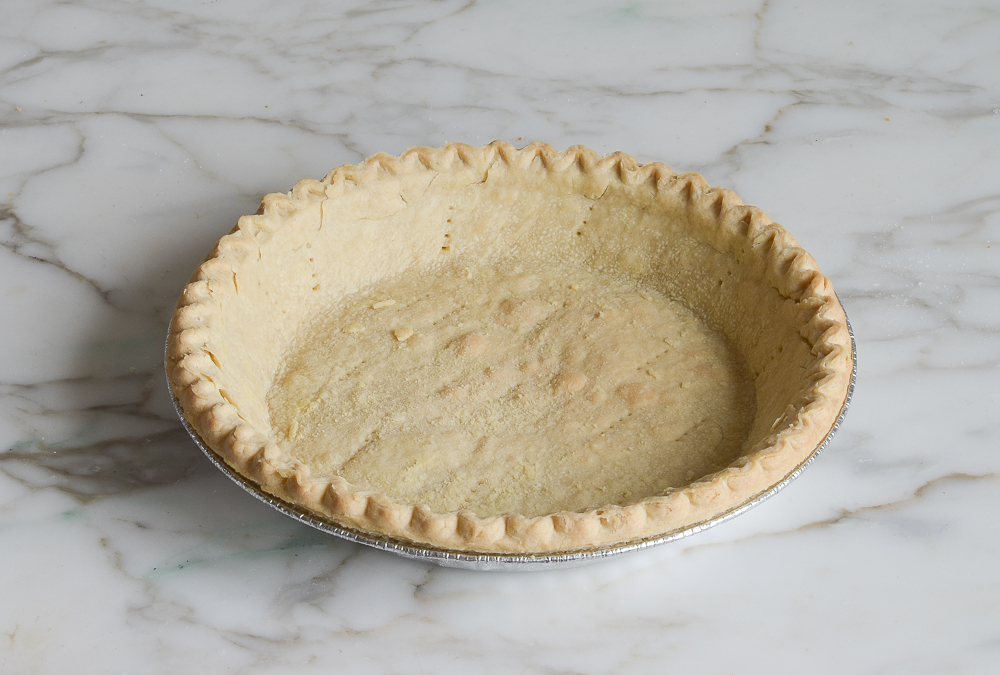 Baked pie crust in a tin.