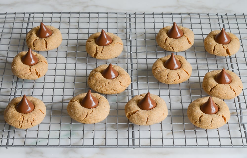 peanut butter blossoms cooling on a rack