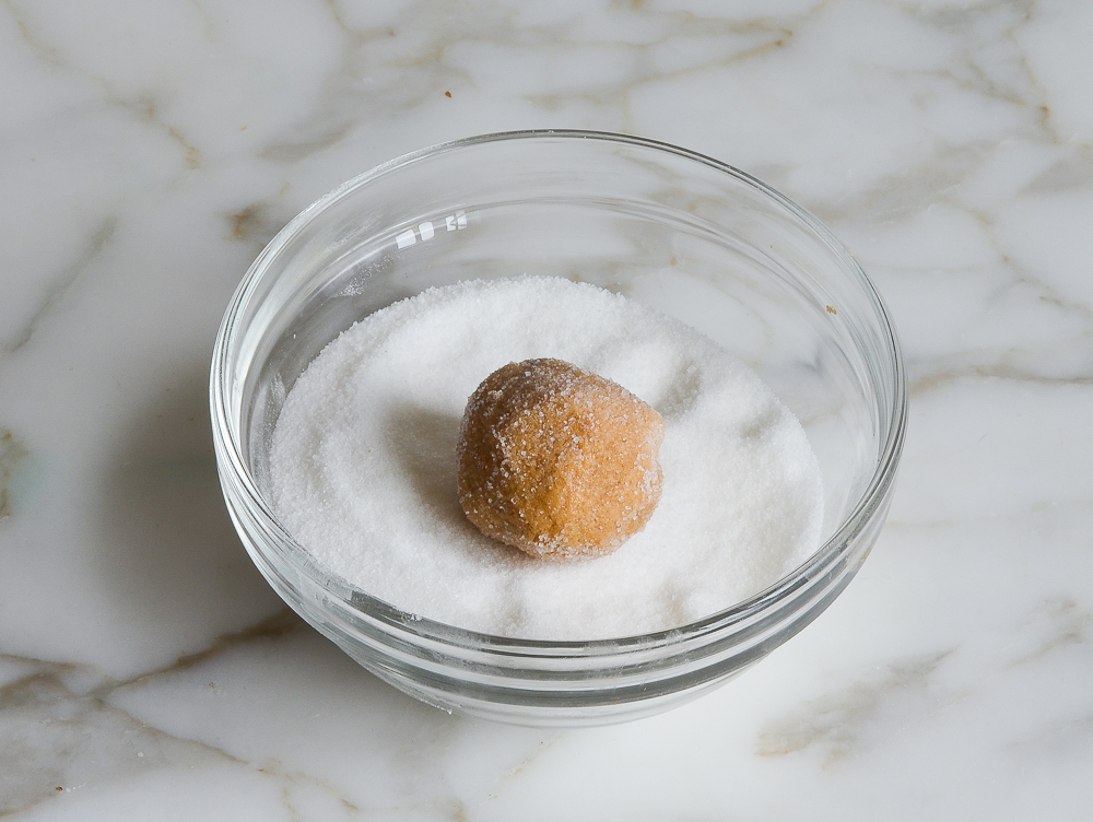 rolling dough ball in sugar