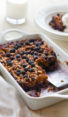 Partially-served dish of blueberry baked oatmeal.