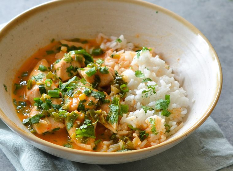 Thai red curry chicken in bowl with jasmine rice