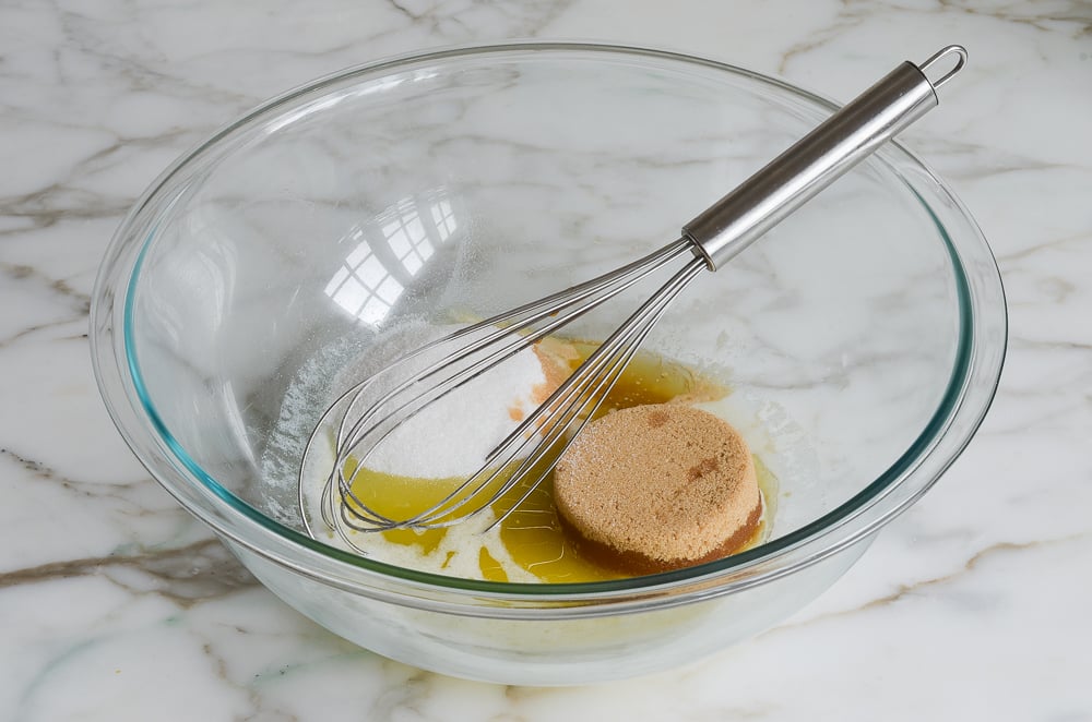 whisking melted butter and sugars