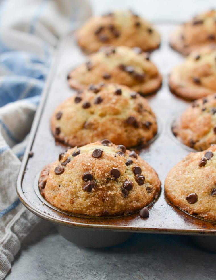 Muffin pan full of chocolate chip muffins.