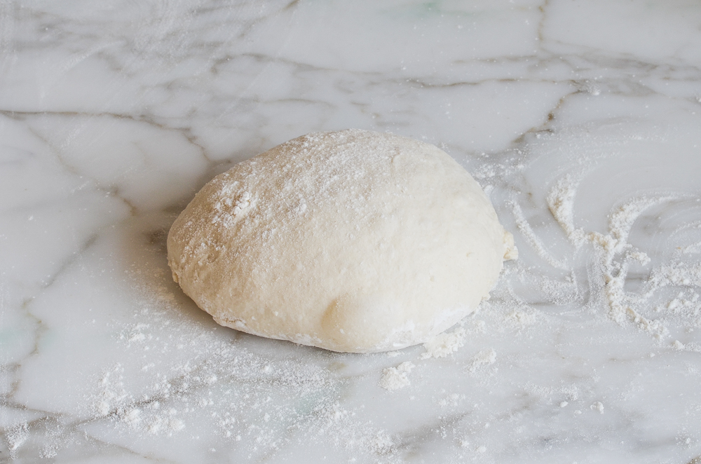 shaping the bread dough into a ball